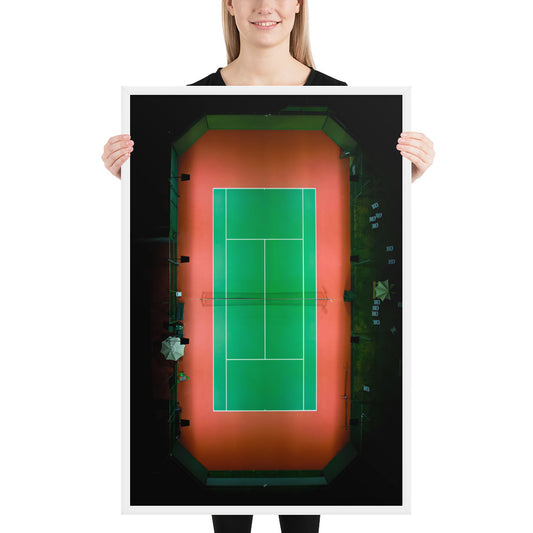 An overhead night view isolates a green tennis court within the warm red surface surrounding it in La Jolla; white frame, 24 × 36 inches.